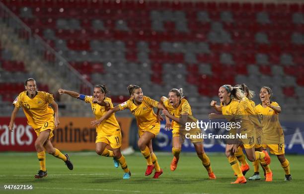 Players of Australia celebrate winning the AFC Women's Asian Cup semi final between Australia and Thailand after a penalty shoot out at the King...