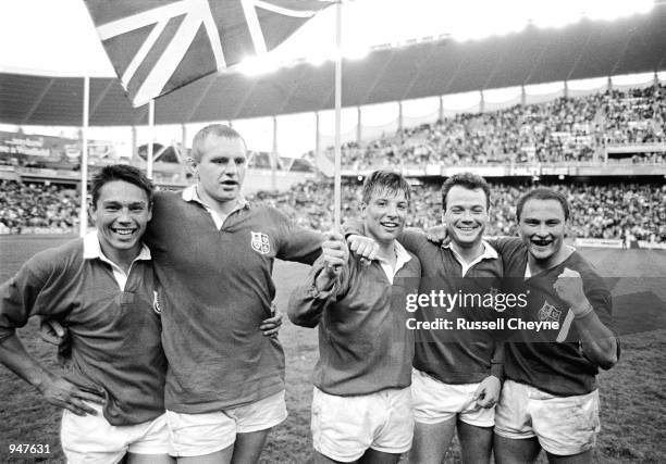 Rory Underwood, Dean Richards, Rob Andrew, Ieuan Evans and Brian Moore of the British Lions celebrate after the third Test match in Sydney during the...