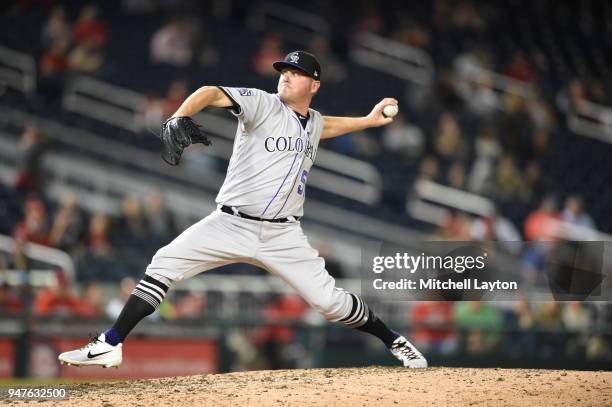 Jake McGee of the Colorado Rockies pitches during a baseball game against the Washington Nationals at Nationals Park on April 12, 2018 in Washington,...