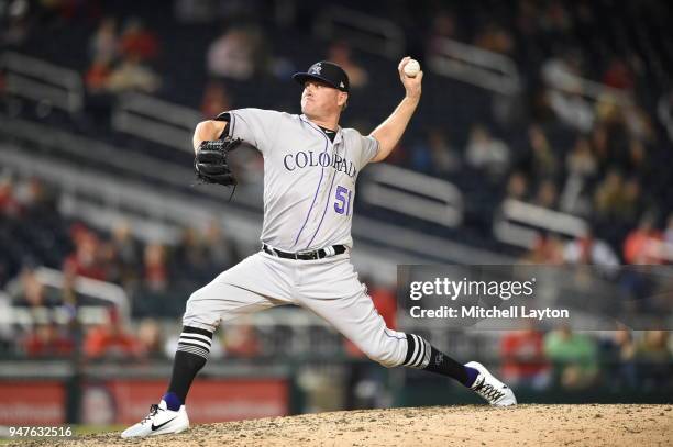 Jake McGee of the Colorado Rockies pitches during a baseball game against the Washington Nationals at Nationals Park on April 12, 2018 in Washington,...