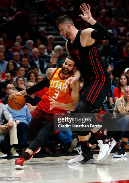 Ricky Rubio of the Utah Jazz drives against Jusuf Nurkic of the Portland Trail Blazers at Moda Center on April 11, 2018 in Portland, Oregon.NOTE TO...