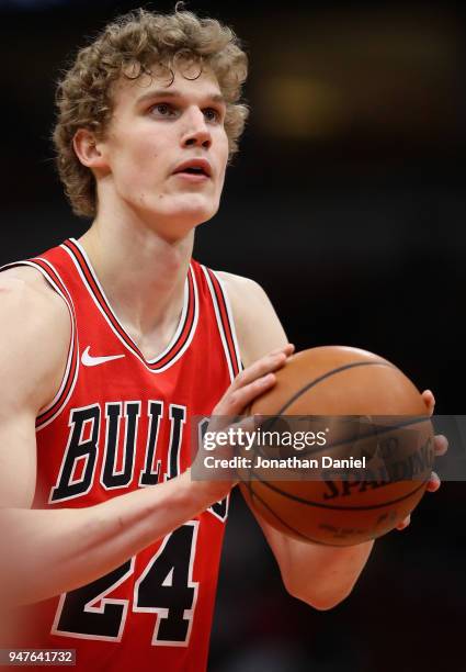 Lauri Markkanen of the Chicago Bulls shoots a free throw against the Memphis Grizzlies at the United Center on March 7, 2018 in Chicago, Illinois....