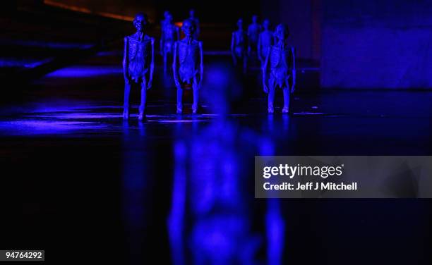 The seven meters crew, bronze statues by sculptor Jens Galschiot, are erected outside the Bella Centre where the Cop 15 climate summit is taking...