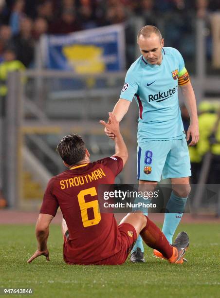 Kevin Strootman and Andres Iniesta during the UEFA Champions League quarter final match between AS Roma and FC Barcelona at the Olympic stadium on...