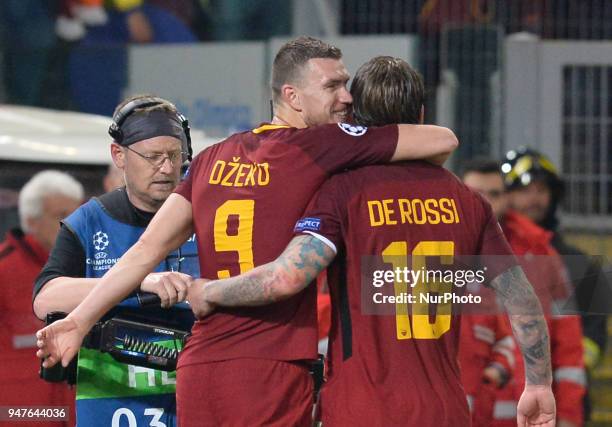 Daniele De Rossi celebrates the victory with Edin Dzeko after the UEFA Champions League quarter final match between AS Roma and FC Barcelona at the...