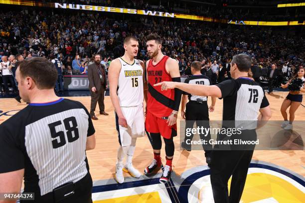 Nikola Jokic of the Denver Nuggets speaks to Jusuf Nurkic of the Portland Trailblazers during the game between the two teams on APRIL 9, 2018 at the...