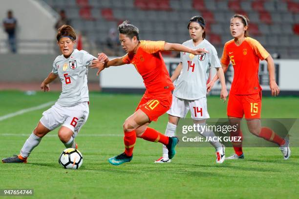 Japan's midfielder Saori Ariyoshi vies for the ball with China's forward Ying Li during the AFC Women's Asian Cup Semi Final match between Japan and...