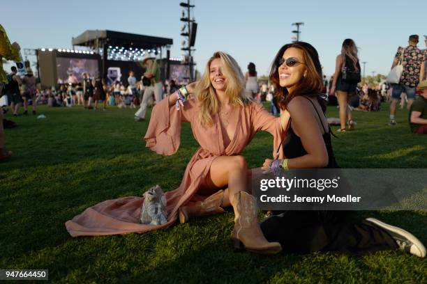 Natasha Oakley and Devin Brugman wearing Monday Swimwear during day 1 of the 2018 Coachella Valley Music & Arts Festival Weekend 1 on April 13, 2018...