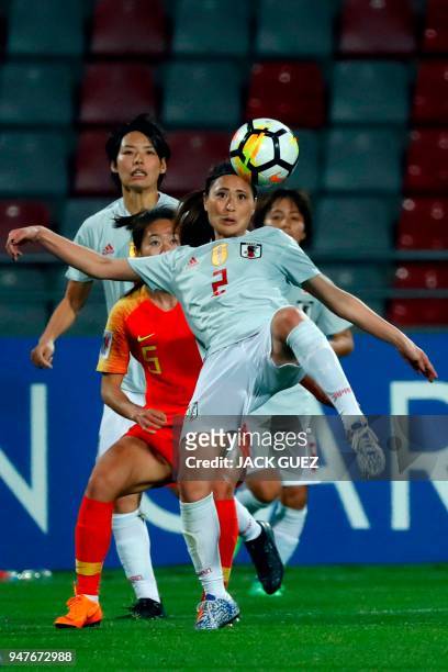 Japan's defender Rumi Utsugivies vies for the ball with China's defender Haiyan Wu during the AFC Women's Asian Cup Semi Final match between Japan...