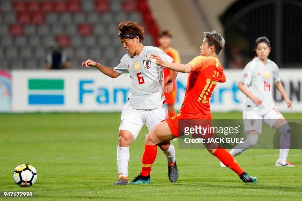 Japan's midfielder Saori Ariyoshi vies for the ball with China's forward Ying Li during the AFC Women's Asian Cup Semi Final match between Japan and...