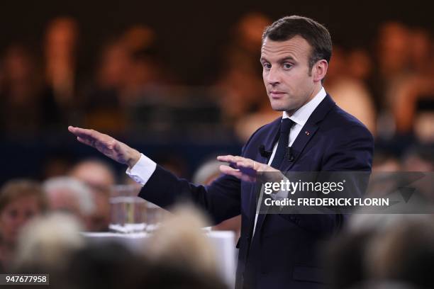 French president Emmanuel Macron gestures as he speaks during the opening of a series of citizen's consultation meetings on Europe on April 17, 2018...