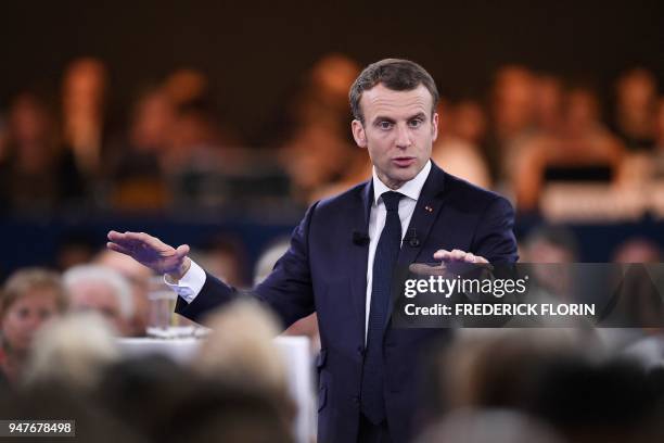 French president Emmanuel Macron gestures as he speaks during the opening of a series of citizen's consultation meetings on Europe on April 17, 2018...