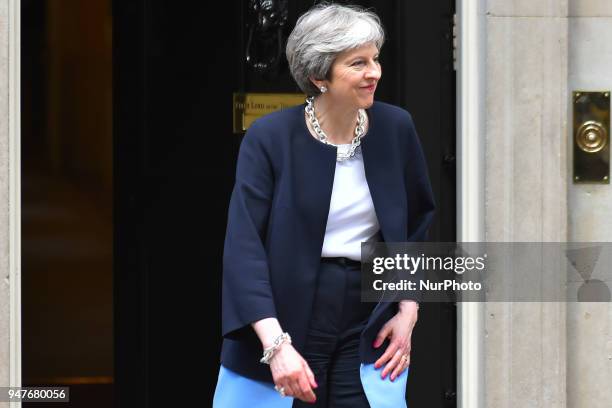 Britain's Prime Minister Theresa May steps down from number 10 to meet South Africa's President Cyril Ramaphosa in central London, prior to bilateral...