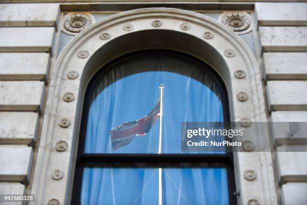 Detail of a window with reflect a UK's flag at Downing Street, London on April 17, 2018.