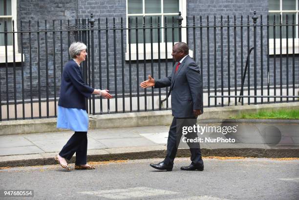 Britain's Prime Minister Theresa May greets South Africa's President Cyril Ramaphosa at 10 Downing Street in central London, prior to bilateral talks...
