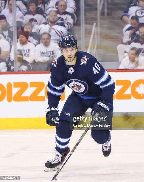 Joel Armia of the Winnipeg Jets keeps an eye on the play during first period action against the Minnesota Wild in Game Two of the Western Conference...