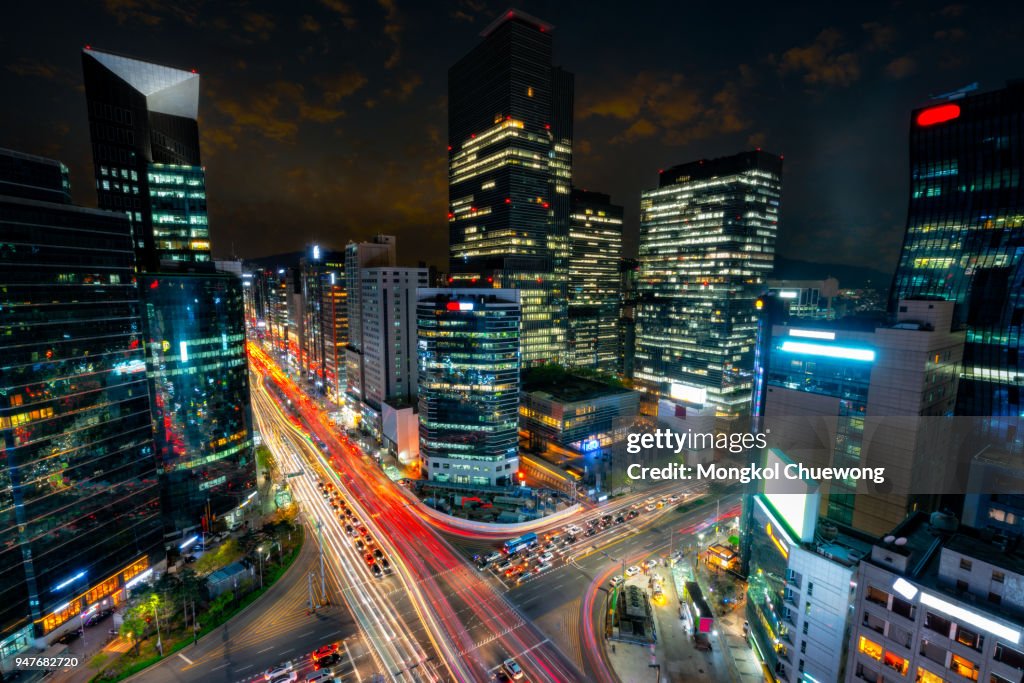 Night scene of light trails traffic speeds through an intersection in Gangnam center business district of Seoul at Seoul city, South Korea.