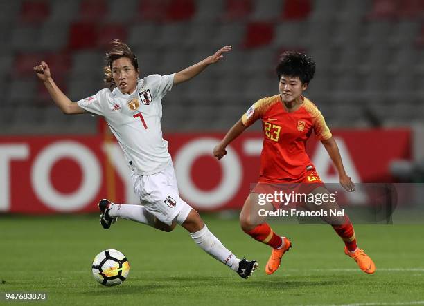Emi Nakajima of Japan and Ren Guixin of China in action during the AFC Women's Asian Cup semi final match between China and Japan at the King...