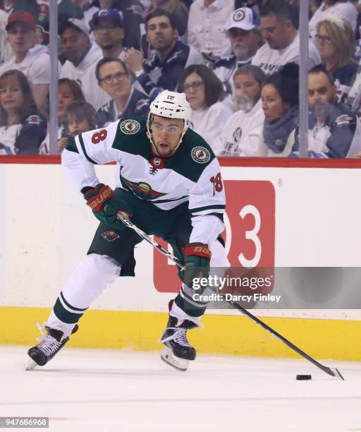 Jordan Greenway of the Minnesota Wild plays the puck down the ice during second period action against the Winnipeg Jets in Game Two of the Western...