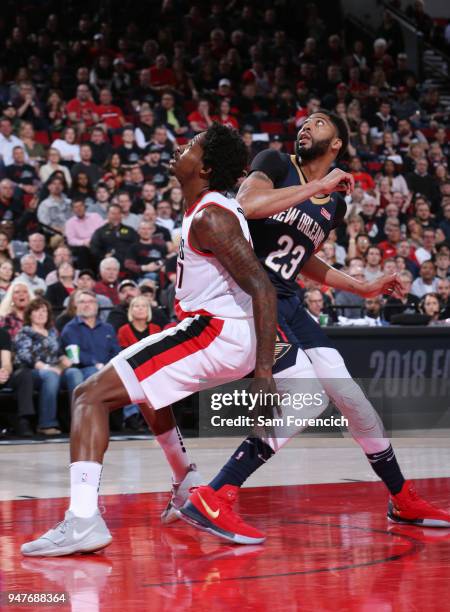 Anthony Davis of the New Orleans Pelicans and Ed Davis of the Portland Trail Blazers react to a play during the game between the two teams in Game...