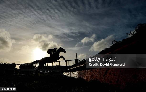 Meath , Ireland - 17 April 2018; Magic Of Light, with Robbie Power up, jump the last during The John & Chich Fowler Memorial EBF Mares Steeplechase...