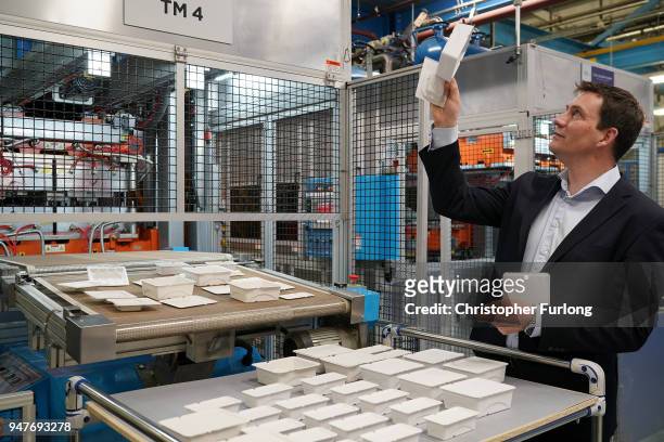 Matthew Miller, Business Director of COLOURFORM, checks packaging made from recycled paper cups using the COLOURFORM at James Cropper recycling plant...