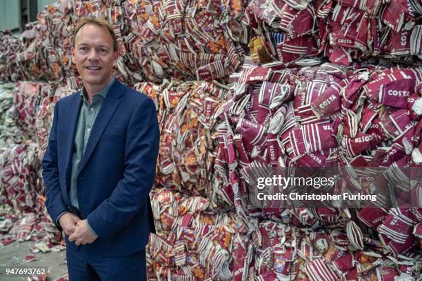 Phil Wild, CEO of James Cropper PLC, poses next to thousands of take-away coffee cups waiting to be recycled at James Cropper recycling plant on...