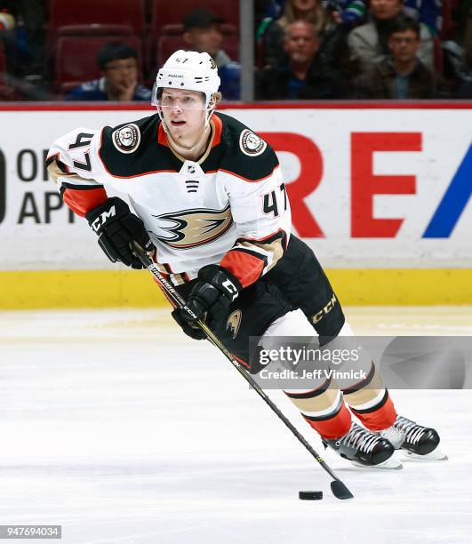 Hampus Lindholm of the Anaheim Ducks skates up ice with the puck during their NHL game against the Vancouver Canucks at Rogers Arena March 27, 2018...