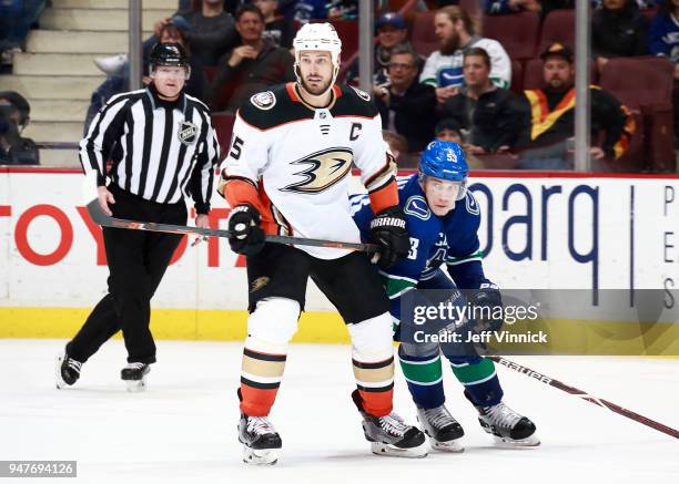 Bo Horvat of the Vancouver Canucks skates by Ryan Getzlaf of the Anaheim Ducks during their NHL game at Rogers Arena March 27, 2018 in Vancouver,...