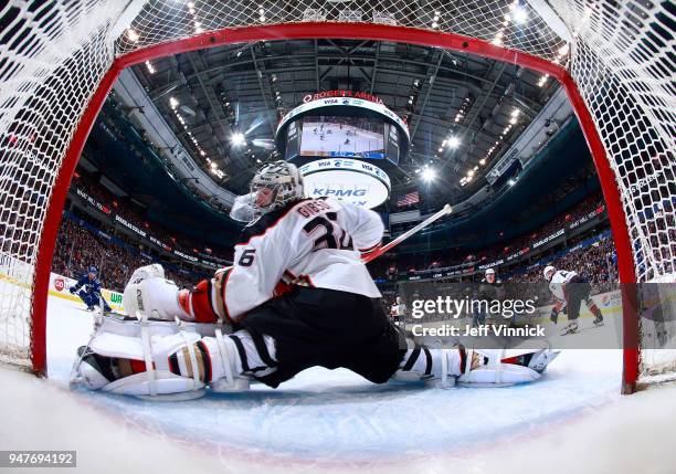 John Gibson of the Anaheim Ducks makes a save during their NHL game against the Vancouver Canucks at Rogers Arena March 27, 2018 in Vancouver,...