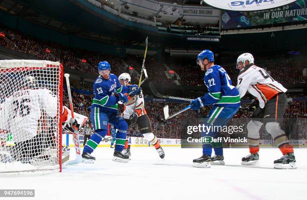 Daniel Sedin and Henrik Sedin of the Vancouver Canucks look on as John Gibson of the Anaheim Ducks makes a save during their NHL game at Rogers Arena...