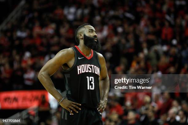 James Harden of the Houston Rockets reacts in the second half during Game One of the first round of the 2018 NBA Playoffs against the Minnesota...