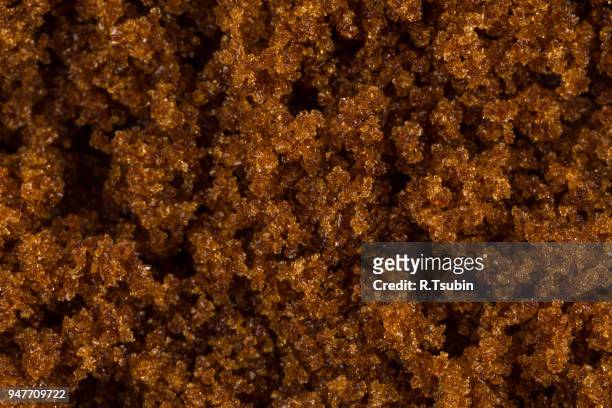 brown muscovado sugar close up macro background shot - molasses stock pictures, royalty-free photos & images