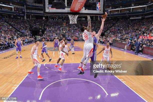 Jack Cooley of the Sacramento Kings shoots against Tarik Black of the Houston Rockets on April 11, 2018 at Golden 1 Center in Sacramento, California....