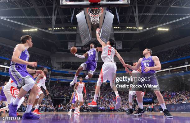 Buddy Hield of the Sacramento Kings goes up for the shot against Zhou Qi of the Houston Rockets on April 11, 2018 at Golden 1 Center in Sacramento,...