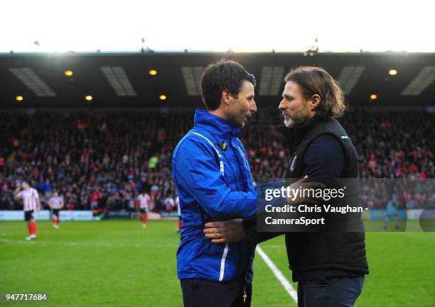 Lincoln City manager Danny Cowley, left, and Wycombe Wanderers manager Gareth Ainsworth shake hands prior to the Sky Bet League Two match between...