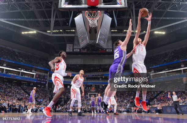 Zhou Qi of the Houston Rockets rebounds against Jack Cooley of the Sacramento Kings on April 11, 2018 at Golden 1 Center in Sacramento, California....