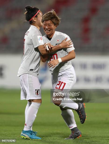 Yokoyama Kumi of Japan celebrates scoring a penalty with Nahomi Kawasumi during the AFC Women's Asian Cup semi final match between China and Japan at...
