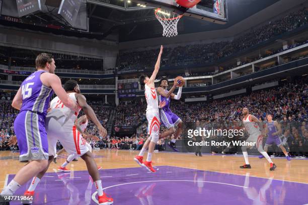 De'Aaron Fox of the Sacramento Kings goes up for the shot against Zhou Qi of the Houston Rockets on April 11, 2018 at Golden 1 Center in Sacramento,...