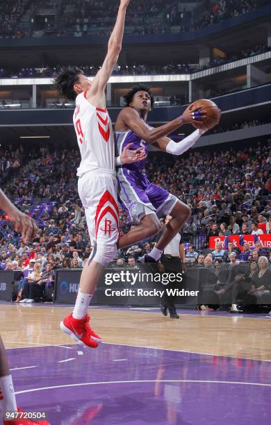 De'Aaron Fox of the Sacramento Kings goes up for the shot against Zhou Qi of the Houston Rockets on April 11, 2018 at Golden 1 Center in Sacramento,...