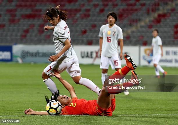Emi Nakajima of Japan runs past Liu Shanshan of China during the AFC Women's Asian Cup semi final match between China and Japan at the King Abdullah...