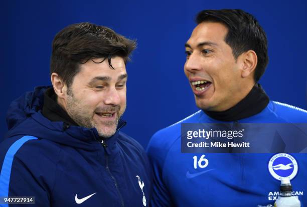 Mauricio Pochettino, Manager of Tottenham Hotspur is seen with Leonardo Ulloa of Brighton and Hove Albion prior to the Premier League match between...