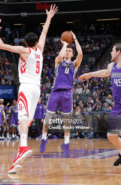 Bogdan Bogdanovic of the Sacramento Kings shoots a three pointer against Zhou Qi of the Houston Rockets on April 11, 2018 at Golden 1 Center in...