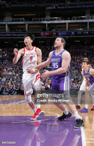 Zhou Qi of the Houston Rockets faces off against Jack Cooley of the Sacramento Kings on April 11, 2018 at Golden 1 Center in Sacramento, California....