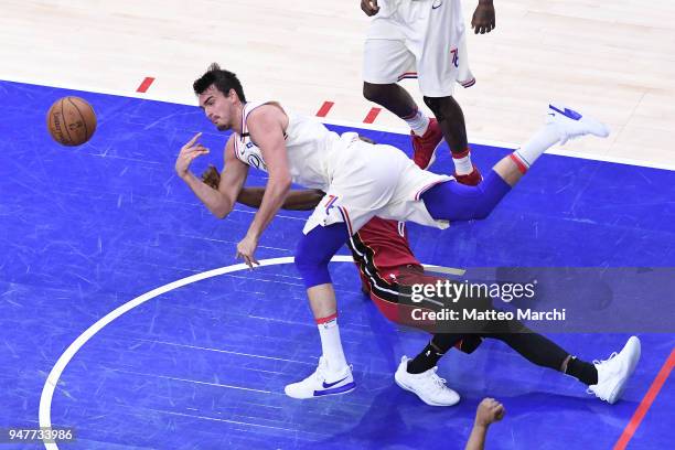 Dario Saric of the Philadelphia 76ers lays up a shot against Josh Richardson of the Miami Heat during game two of round one of the 2018 NBA Playoffs...