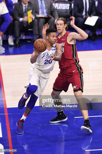 Markelle Fultz of the Philadelphia 76ers passes the ball against Kelly Olynyk of the Miami Heat during game two of round one of the 2018 NBA Playoffs...