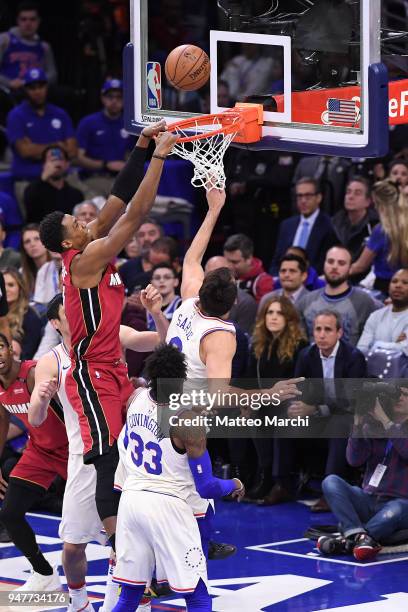 Hassan Whiteside of the Miami Heat dunks the ball against Dario Saric of the Philadelphia 76ers during game two of round one of the 2018 NBA Playoffs...