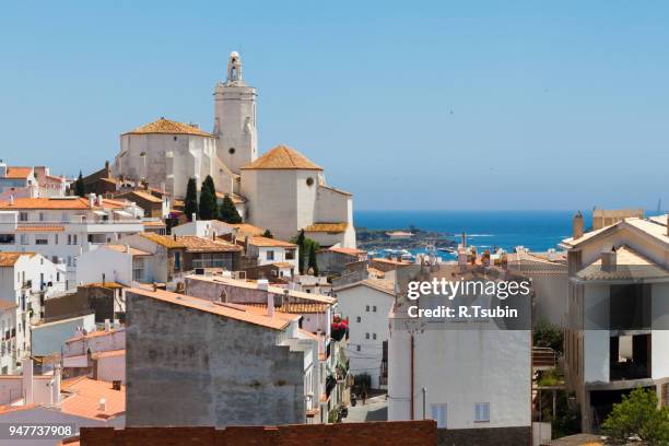 panorama of white village houses and church tower in cadaques, spain - cadaqués stockfoto's en -beelden