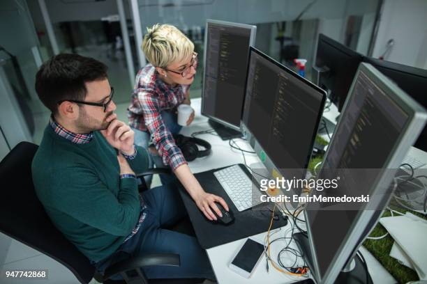 software developers at work - o stock pictures, royalty-free photos & images