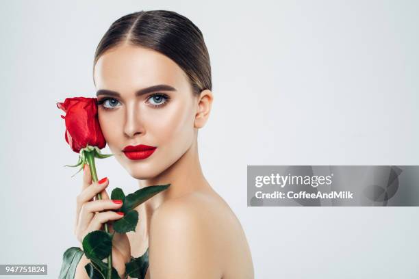 beautiful girl with red rose - happy birthday red roses stock pictures, royalty-free photos & images